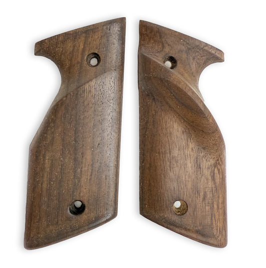 Walnut grips with raised thumb shelf for right handed shooters